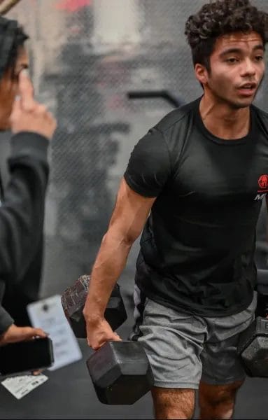 CrossFit Warehouse Coach motivating Teen