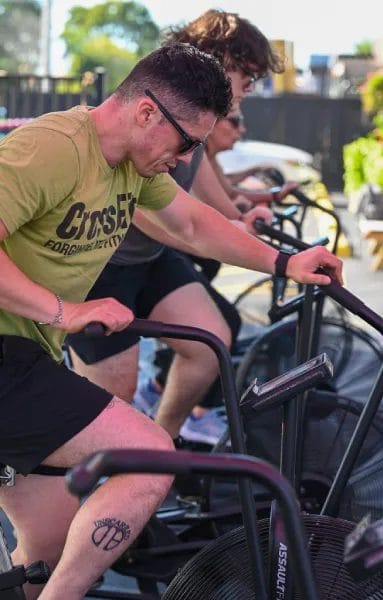 CrossFit Warehouse People on Exercise Bikes